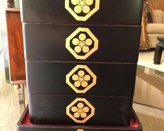 Chinese lacquered stacking boxes.