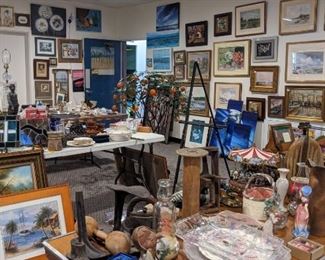 A whole room full of artwork, collectibles, and antiques
