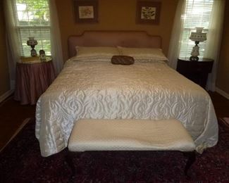 King size bed with upholstered headboard and matching comforter