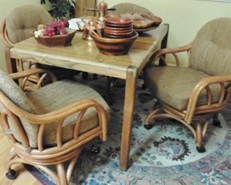Four rattan rolling chairs-sold; Parson's table