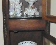 Curio cabinet with figurines and Dresden compote