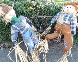 Scarecrows handing on a metal bench