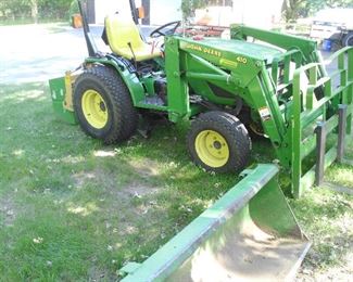 John Deere 4100 tractor with bucket, fork lift & mower deck.