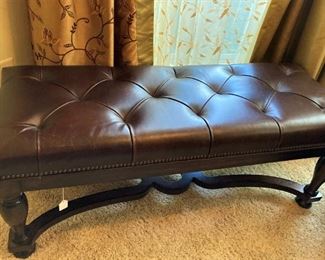 One of two good-looking matching leather and wood benches