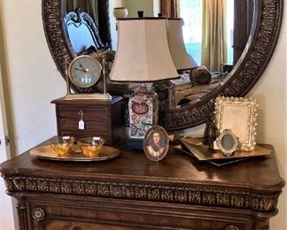 3- drawer chest; round mirror; lamp; décor