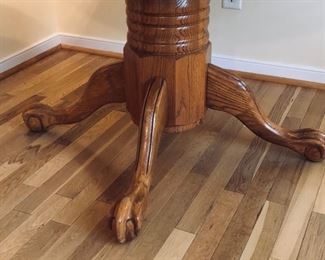 Claw foot oak dining table with two leaves
