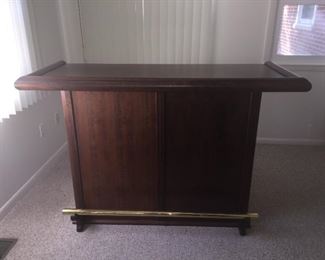 Beautiful Wood Bar with Brass Rail (front).  Top 60x24 and 41 tall. Base is 46x17