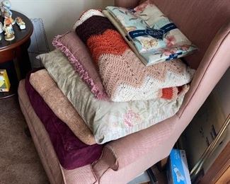 Well loved pink arm chair $40
Linens & blankets 