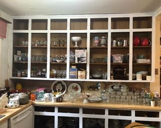Various glassware, Mason jars, Marcrest, pewter steins, Blue Willow, Pfaltzgraff set, salt and pepper shakers, tea kettles, trays, and mugs.