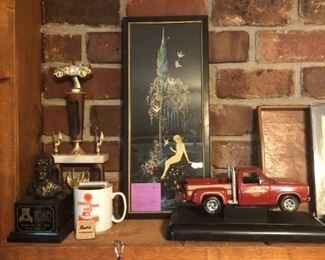 Art pieces, trophies, die cast cars.