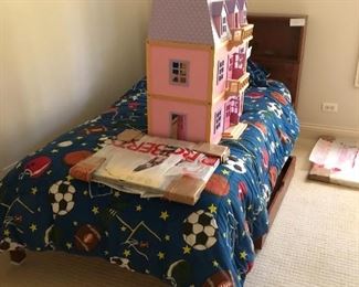Twin bed with head board and Melissa and Doug doll house with furniture