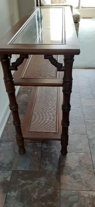 Nice sofa/entry way table.  Multipurpose with wicker-look shelves and removable glass top. 