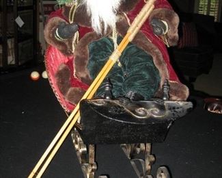 Traditional Father Christmas with Ski Poles and a Sleigh