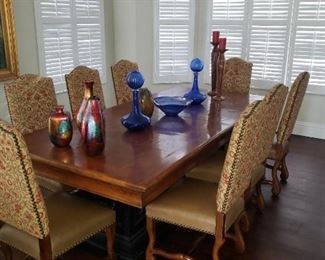 Banquet size solid carved elm wood table with leaf and eight carved  upholster chairs  $2,500   Two arm  chairs available 