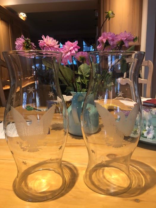 pair of glass candle protectors