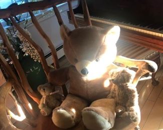 A bunch of bears on a handmade, big sturdy chair