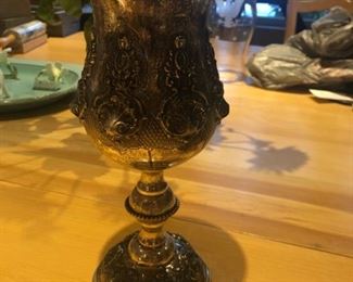 We think a kiddush cup.  It is huge and sterling silver