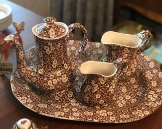 Part of a set of brown and white china.  The rest will be out by the date of the sale