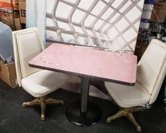 MCM Pink rectangular formica top with white & gray floral design on opposite corners, chrome trim & base cylinder with black painted round metal base Table only $295 Off-white vinyl swivel chairs on gold metallic legs Chairs only $295 Set complete $495