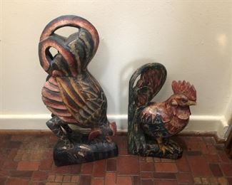 carved wooden roosters