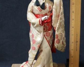 113 - Oriental Doll on Wood Stand 