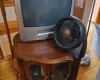 25" TV, Wire front doors accent table, portable mini fan.
