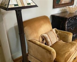 Floor lamp with "stained glass" style shade.  Velvet club chair.