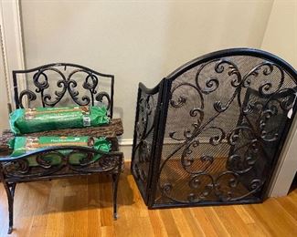 Ornate metal fireplace screen and matching wood holder.