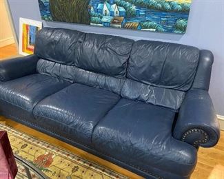 Navy nailhead leather sofa.