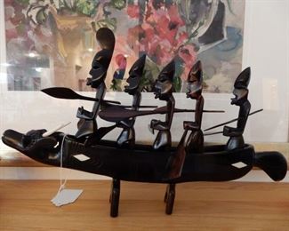 THIS MAY BE ROSEWOOD --A SCULPTURE CARVING WITH 5 MEN AND 10 POSEABLE  PADDLES --VERY INTERESTING
