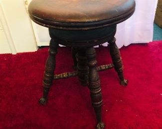 Piano stool with glass ball and claw feet
