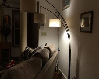 Tree Floor Lamp . Three  Lights that turn on  three ways.  Shown here with one light on. Height of tallest light  branch is  77.5in. Middle light branch is 72in. Lower light branch is 65 in. The span of the branches are adjustable.