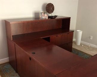 Stanley Furniture 3 or 4 piece office desk U shape with removable hutch. 3 separate desk pieces. Desk is in good useable shape, could benefit from someone fixing the bottom of file drawers - does not affect function. The part with the monitor on it in the photos measures 35.75" deep x 71.75" long x 28.5" tall. Middle section that has the drawer pulls out measures 23.75" deep x 48.5" long. Part with the hutch attached measures 71.75" long x 21" deep. The hutch adds 15.25" to the height bringing it to 44" tall. This last piece has 2 lateral hanging file cabinets. (Owner paid close to $2000 for this desk) Based on condition we're selling for $300