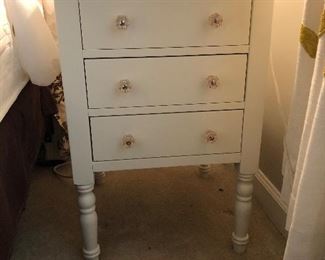 Crate & Barrel or Pottery Barn nightstand. 3 drawers and has hole in the back for plugs/chargers. $125