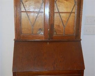 VIntage hand built Oak Secretary.  Leaded glass in top of cabinet