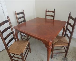Nice square kitchen table with four rush seat ladderback chairs
