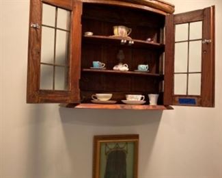 Wall cabinet, framed vintage evening purse 