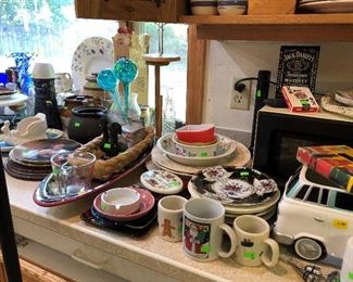 Dishes, measuring cups, ash trys, coffee cups, VW jar.