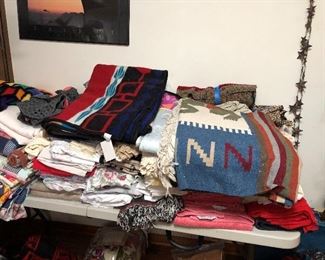 Linens, vintage and modern.  Blankets, towels, placemats.