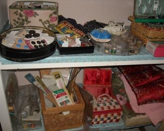 Large tin filled with old buttons, sewing boxes, pin cushions,  miscellaneous sewing supplies