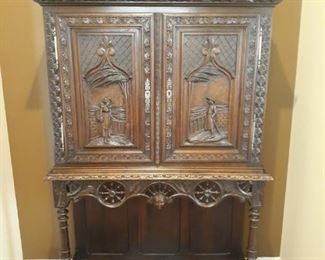 Antique hand carved break front bar cabinet