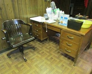 Antique wood desk and office chair on casters