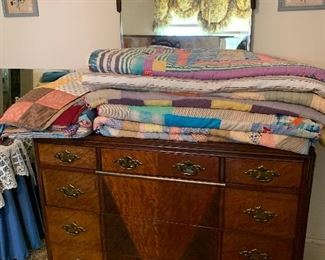 Beautiful dresser and a collection of vintage quilts that are in great shape