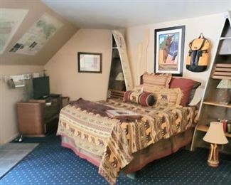 Queen bed, Shelves made with a canoe, Beautiful old chest of drawers. Great Yellowstone print.
