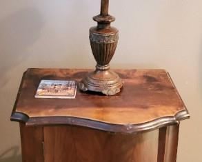 Lots of small antique tables and cabinets