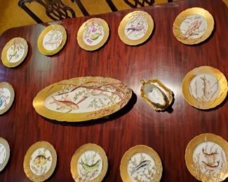 Fine quality Limoges hand painted fish set with raised enameled detaiing. 