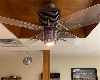 Light fixture With fan resembling the motor and headlight of a motorcycle