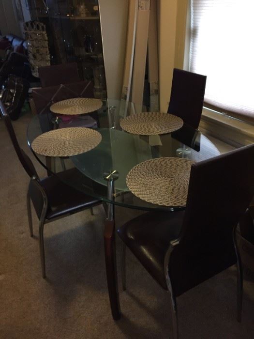Glass oval dining table 4 chairs.