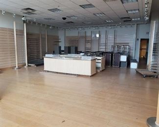 Lot of slat wall and fixtures hanging on wall