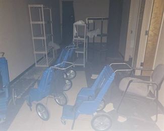 Contents of area - 5 strollers, storage shelves